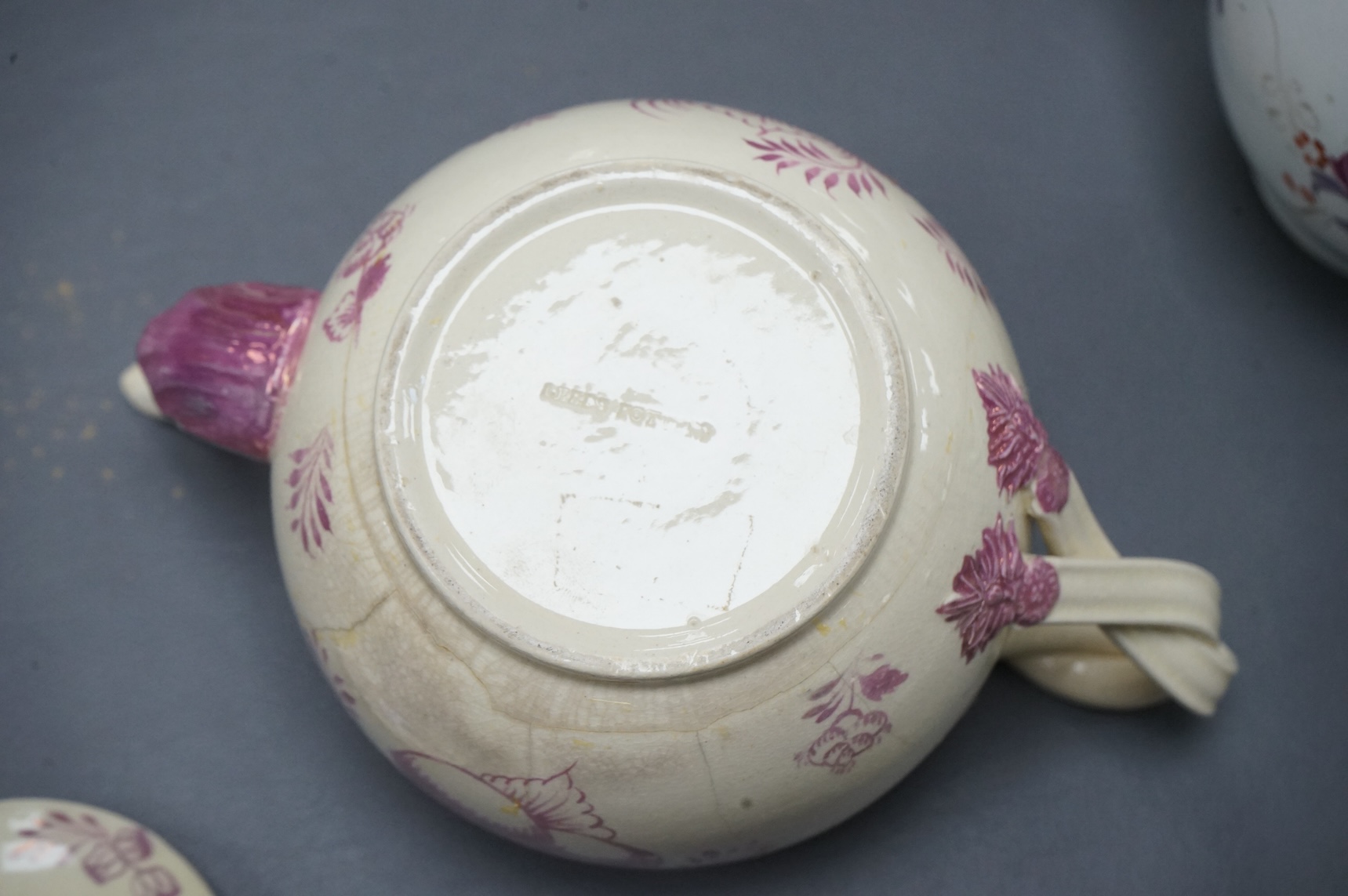 Leeds pottery, a creamware teapot, c.1785 and a pearlware teapot, c.1795, both stamped, tallest 13cm high